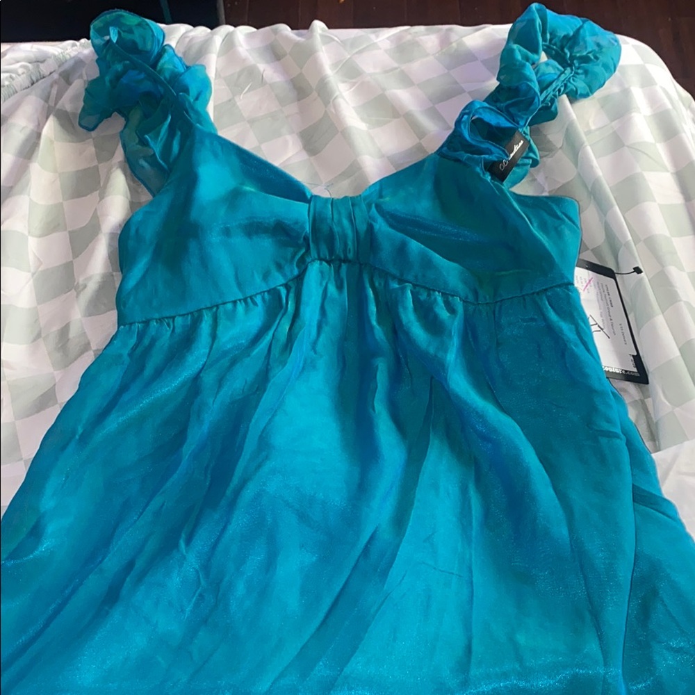 Green Sleeveless Ruffled Tie Front Blouse